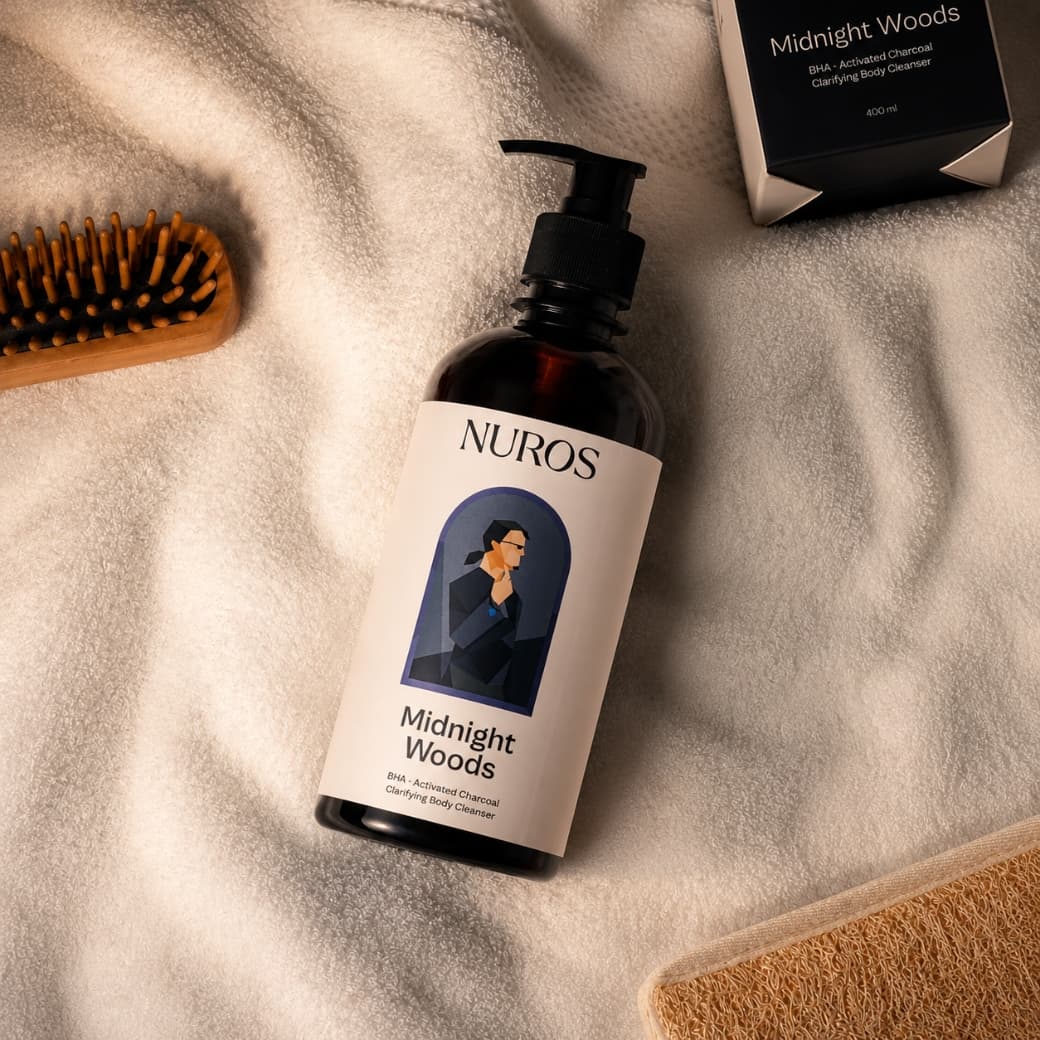 NUROS Midnight Woods bottle and box on a cream towel