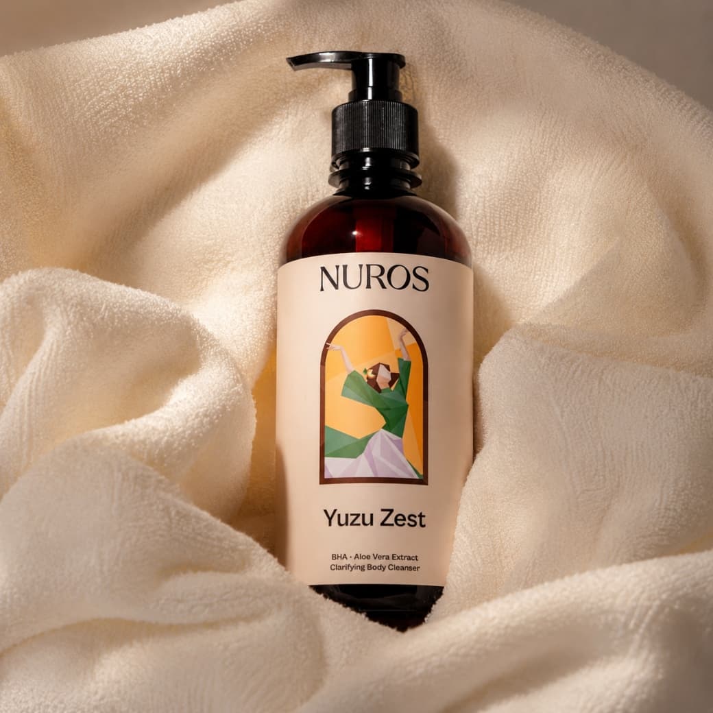 NUROS Yuzu Zest bottle resting on a cream towel